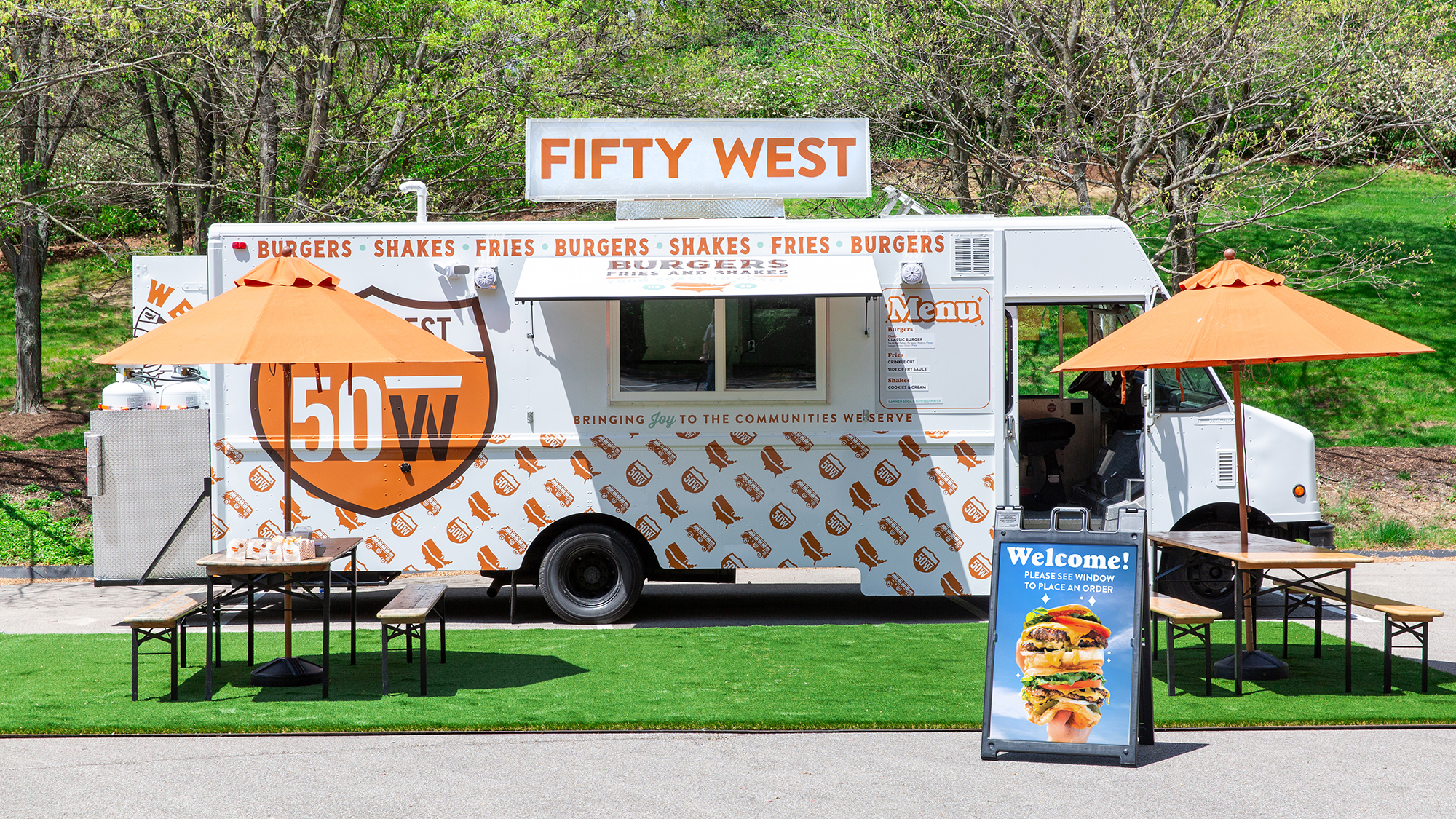 Fifty West Food Truck on grass at an outdoor event