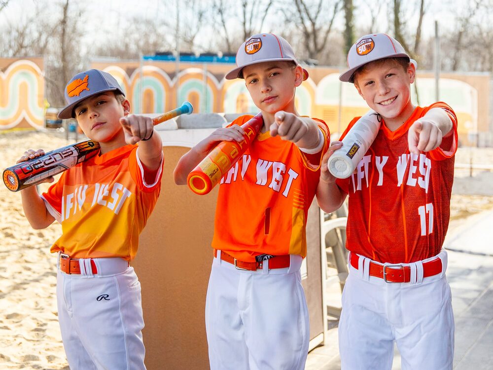 Fifty West youth baseball team celebrating after a game