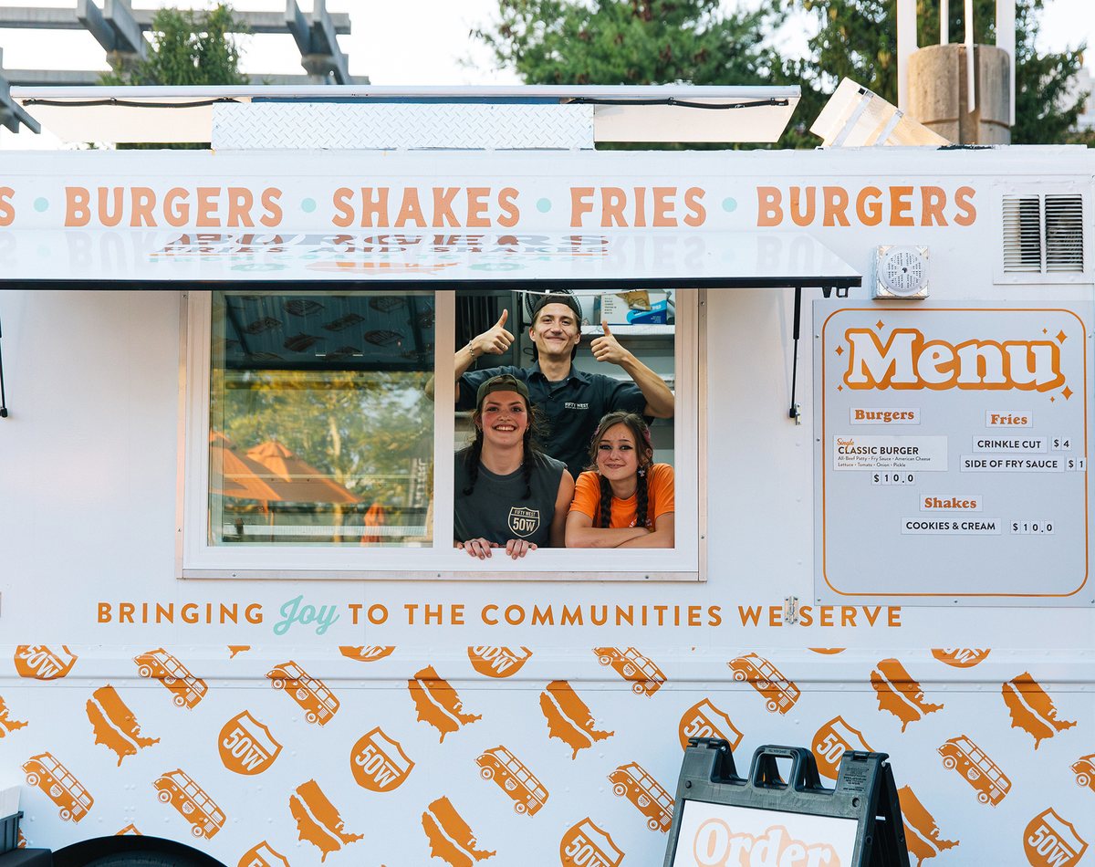 Fifty West food truck team giving a thumbs up